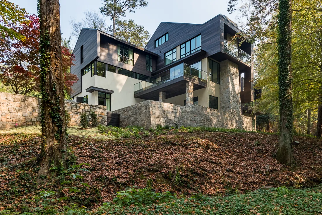 Avalon — Exterior with stacked granite and glass