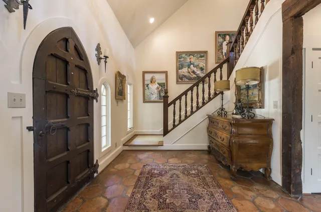 Tuxedo Road — Entry with arched wooden door