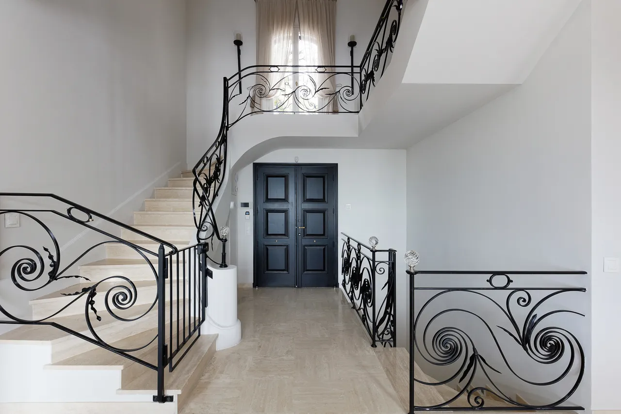 Côte d’Azur — Stair hall with wrought-iron balustrade