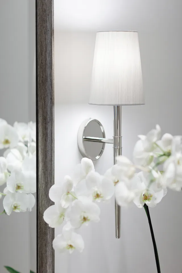 Côte d’Azur — Orchids beneath a wall sconce
